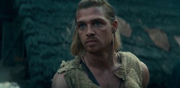 Movie still from “Barbarians” (2020), created by Arne Nolting – A person with long blonde hair; Close Up shot, Over the shoulder angle