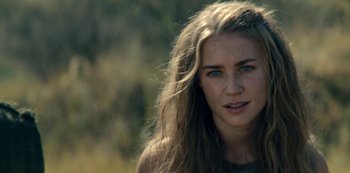 Movie still from “Barbarians” (2020), created by Arne Nolting – A person with long brown hair; Close Up shot, Over the shoulder angle