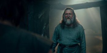 Movie still from “Barbarians” (2020), created by Arne Nolting – An old man with a beard and long hair; Medium shot, Low angle
