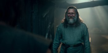Movie still from “Barbarians” (2020), created by Arne Nolting – An old man with a beard and long hair; Medium shot, Low angle