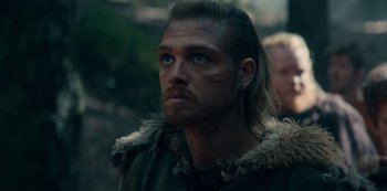 Movie still from “Barbarians” (2020), created by Arne Nolting – A person with long blonde hair; Close Up shot, Over the shoulder angle