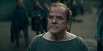 Movie still from “Barbarians” (2020), created by Arne Nolting – An older man with a beard and a mustache; Close Up shot, Low angle