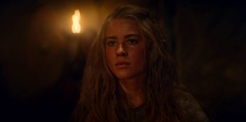 Movie still from “Barbarians” (2020), created by Arne Nolting – A woman with long blonde hair stares into the camera; Close Up shot, Over the shoulder angle