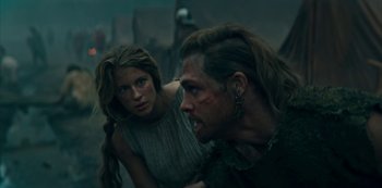 Movie still from “Barbarians” (2020), created by Arne Nolting – A man and a woman are sitting next to each other; Medium shot, Low angle