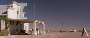 Movie still from “Joy Ride” (2001), directed by John Dahl – An abandoned gas station in the middle of the desert; Extreme Wide shot, Low angle
