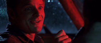 Movie still from “Joy Ride” (2001), directed by John Dahl – A person in a car at night; Close Up shot, Low angle