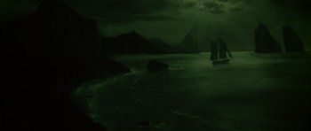 Movie still from “Joy Ride” (2001), directed by John Dahl – A dark picture of a body of water with mountains in the background; Extreme Wide shot, High angle