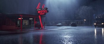 Movie still from “Joy Ride” (2001), directed by John Dahl – A lone star motel in the middle of the rain; Extreme Wide shot, High angle