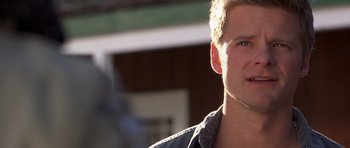 Movie still from “Joy Ride” (2001), directed by John Dahl – A person wearing a jacket; Close Up shot, Over the shoulder angle