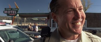 Movie still from “Joy Ride” (2001), directed by John Dahl – A person holding a microphone; Close Up shot, Low angle