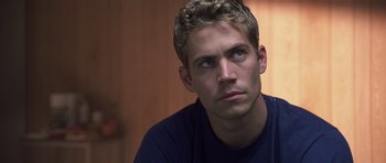 Movie still from “Joy Ride” (2001), directed by John Dahl – A man that is looking at the camera; Close Up shot, Over the shoulder angle