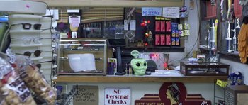An alien head sits on a counter in a store