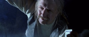 Movie still from “Joy Ride” (2001), directed by John Dahl – A person with long white hair; Close Up shot, Low angle