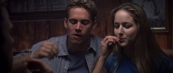 Movie still from “Joy Ride” (2001), directed by John Dahl – A man and a woman sitting next to each other; Close Up shot, Over the shoulder angle