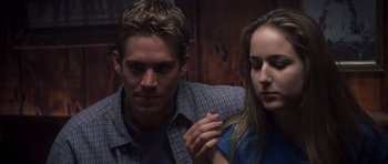 Movie still from “Joy Ride” (2001), directed by John Dahl – A man and a woman standing next to each other; Close Up shot, Over the shoulder angle