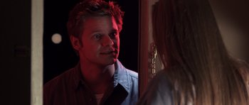 Movie still from “Joy Ride” (2001), directed by John Dahl – A man looking at a woman in a mirror; Close Up shot, Over the shoulder angle