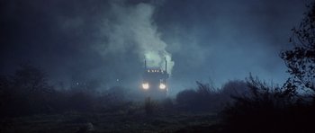 Movie still from “Joy Ride” (2001), directed by John Dahl – A truck driving down a road in the fog; Extreme Wide shot, Low angle