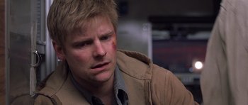 Movie still from “Joy Ride” (2001), directed by John Dahl – A person wearing a jacket; Close Up shot, Over the shoulder angle