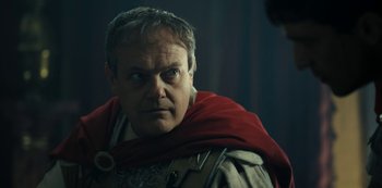 Movie still from “Barbarians” (2020), created by Arne Nolting – A person wearing a costume; Close Up shot, Over the shoulder angle