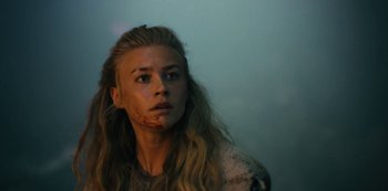 Movie still from “Barbarians” (2020), created by Arne Nolting – A young woman with blood all over her face; Close Up shot, Low angle