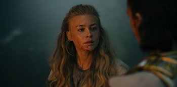 Movie still from “Barbarians” (2020), created by Arne Nolting – A young woman with a bruised face looking at the camera; Close Up shot, Over the shoulder angle