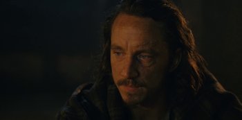 Movie still from “Barbarians” (2020), created by Arne Nolting – A person with long brown hair; Close Up shot, Over the shoulder angle
