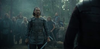 Movie still from “Barbarians” (2020), created by Arne Nolting – A group of people dressed in medieval clothing; Medium shot, Over the shoulder angle