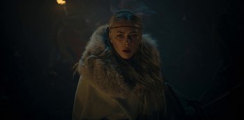 Movie still from “Barbarians” (2020), created by Arne Nolting – A woman in a white coat and a fur coat; Close Up shot, Low angle