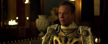 Movie still from “Pompeii” (2014), directed by Paul W.S. Anderson – A person wearing a suit of armor; Close Up shot, Over the shoulder angle