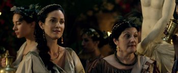 Movie still from “Pompeii” (2014), directed by Paul W.S. Anderson – Two women in renaissance garb standing next to each other; Close Up shot, Over the shoulder angle