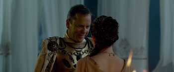 Movie still from “Pompeii” (2014), directed by Paul W.S. Anderson – A man and a woman are dressed in medieval garb; Close Up shot, Over the shoulder angle