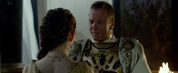 Movie still from “Pompeii” (2014), directed by Paul W.S. Anderson – A man and a woman in medieval garb talking to each other; Close Up shot, Over the shoulder angle