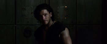 Movie still from “Pompeii” (2014), directed by Paul W.S. Anderson – A person wearing a black shirt; Close Up shot, Low angle