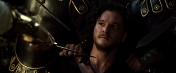 Movie still from “Pompeii” (2014), directed by Paul W.S. Anderson – A person holding a pair of scissors; Close Up shot, Over the shoulder angle