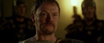 Movie still from “Pompeii” (2014), directed by Paul W.S. Anderson – A person with a beard; Close Up shot, Over the shoulder angle