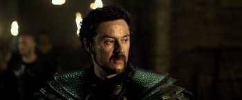 Movie still from “Pompeii” (2014), directed by Paul W.S. Anderson – A person wearing a costume; Close Up shot, Over the shoulder angle