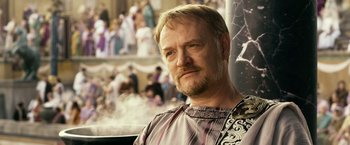 Movie still from “Pompeii” (2014), directed by Paul W.S. Anderson – A person wearing a shirt; Close Up shot, Over the shoulder angle