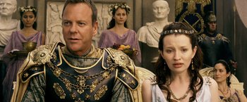 Movie still from “Pompeii” (2014), directed by Paul W.S. Anderson – A man and a woman dressed in ancient roman garb; Close Up shot, Over the shoulder angle