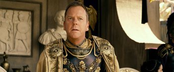 Movie still from “Pompeii” (2014), directed by Paul W.S. Anderson – A person wearing a suit of armor; Close Up shot, Over the shoulder angle