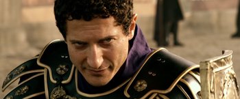 Movie still from “Pompeii” (2014), directed by Paul W.S. Anderson – A person wearing a uniform; Close Up shot, Low angle