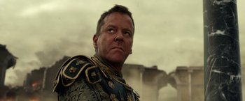 Movie still from “Pompeii” (2014), directed by Paul W.S. Anderson – A person wearing a uniform; Close Up shot, Low angle