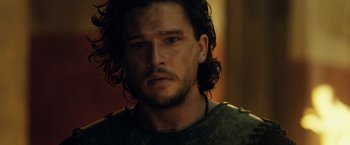 Movie still from “Pompeii” (2014), directed by Paul W.S. Anderson – A person with long hair; Close Up shot, Over the shoulder angle