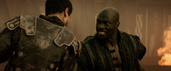 Movie still from “Pompeii” (2014), directed by Paul W.S. Anderson – Two men are facing each other and one is angry; Close Up shot, Over the shoulder angle