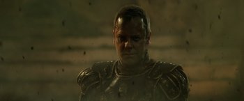 Movie still from “Pompeii” (2014), directed by Paul W.S. Anderson – A person wearing a suit of armor; Close Up shot, Low angle