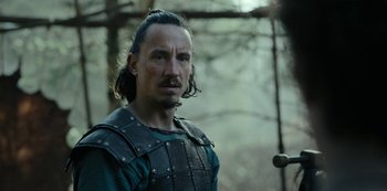 Movie still from “Barbarians” (2020), created by Arne Nolting – A person wearing a costume; Close Up shot, Over the shoulder angle