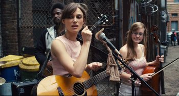 Movie still from “Begin Again” (2013), directed by John Carney – Medium shot, Over the shoulder angle