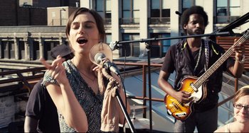 Movie still from “Begin Again” (2013), directed by John Carney – Medium shot, Low angle