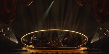 A group of people playing musical instruments on stage