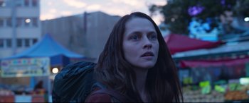 Movie still from “Berlin Syndrome” (2017), directed by Cate Shortland – A woman with long hair is looking into the distance; Close Up shot, Over the shoulder angle