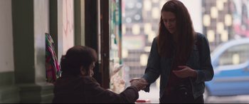 Movie still from “Berlin Syndrome” (2017), directed by Cate Shortland – A man and a woman shaking hands in front of a store window; Medium shot, Over the shoulder angle